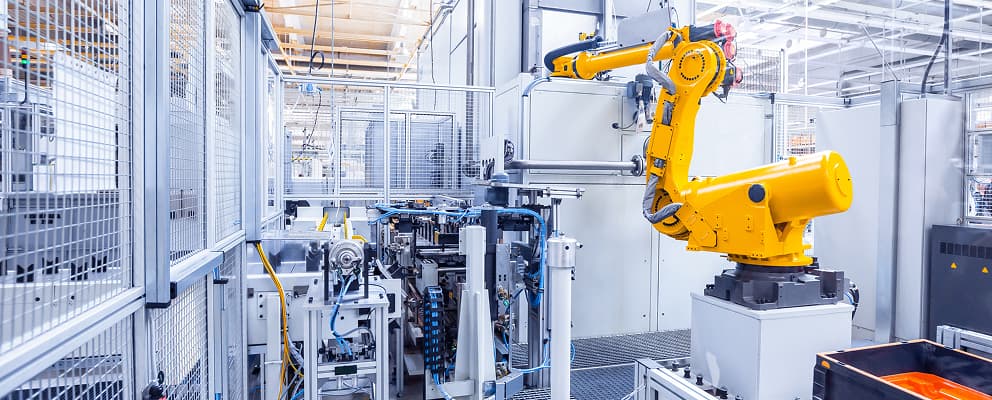 Automated discrete manufacturing facility with robotic production equipment
