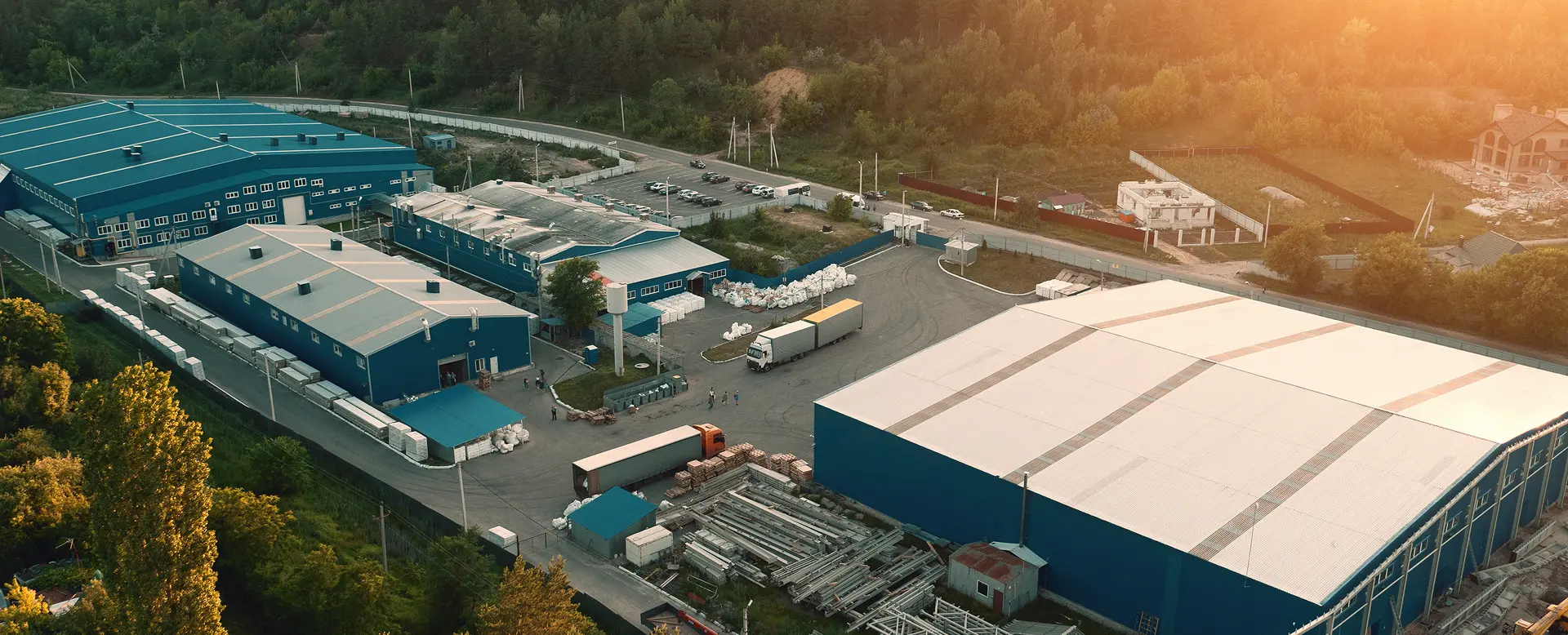 Aerial view of warehouse storage buildings and logistics centre at sunset