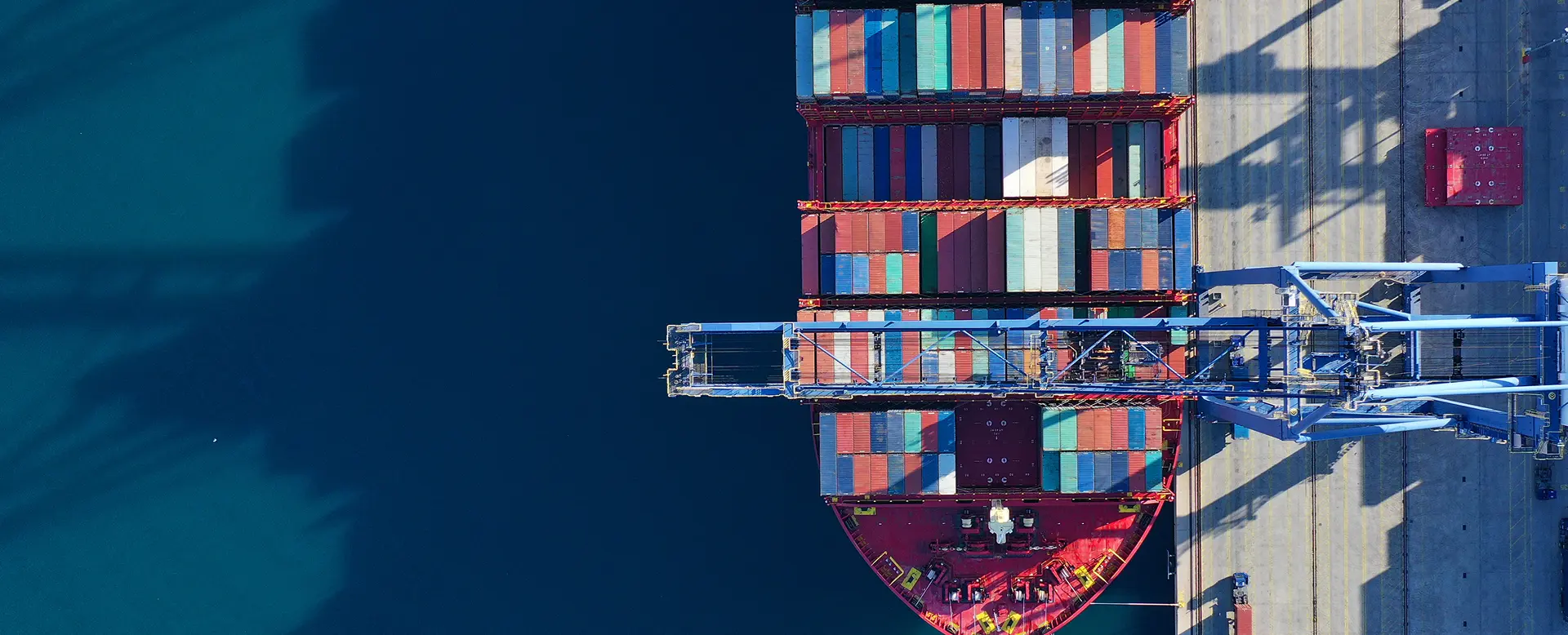 Top-down view of cargo containers at an industrial logistics port