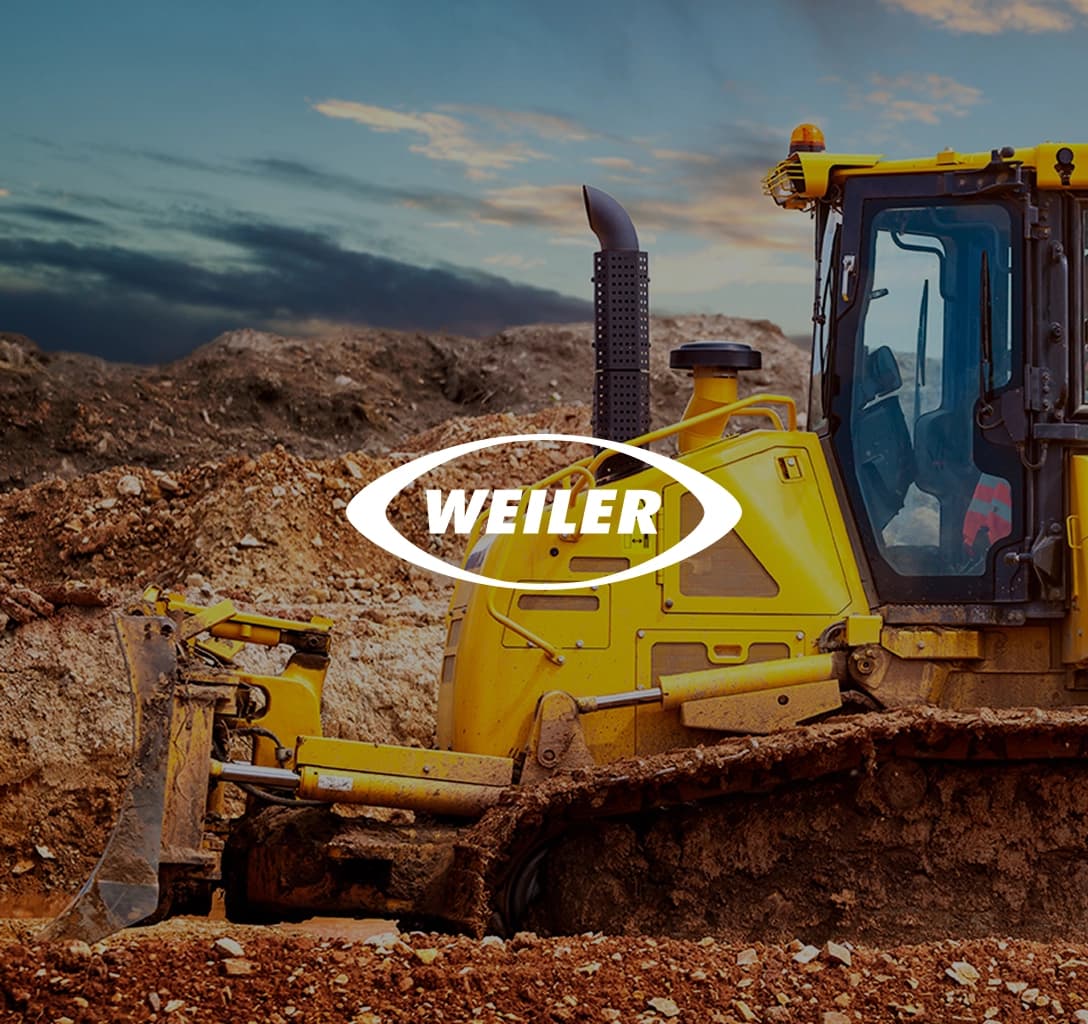 Weiler logo with a bulldozer in the background.