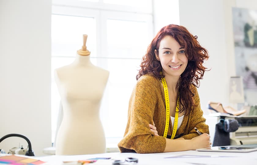Apparel: a woman sitting in a sewing room