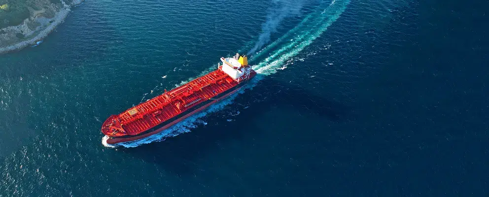 Cargo ship transporting goods for Aptean transportation management solutions