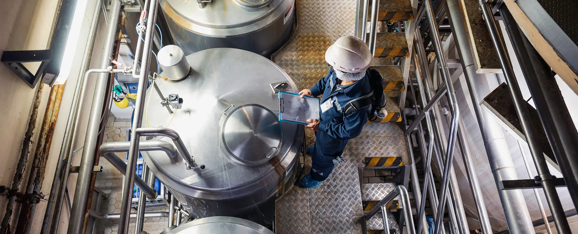 Chemical manufacturing equipment operating inside an industrial production facility