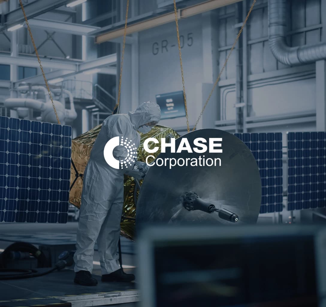 The Chase Corporation logo, set against a background showing a person in protective clothing at work