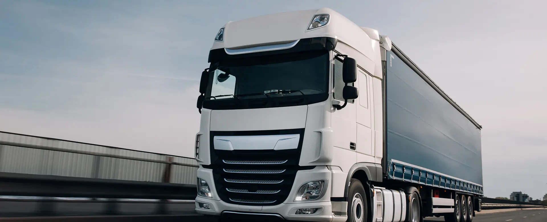 Freight semi truck transporting goods on highway for distributionTransportation Management System (TMS)