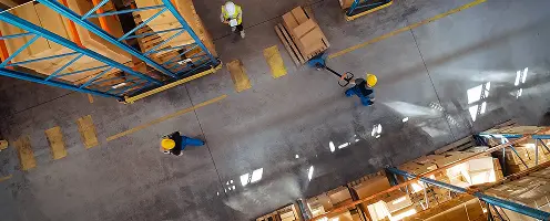 Overhead view of warehouse operations monitored with Aptean OEE software