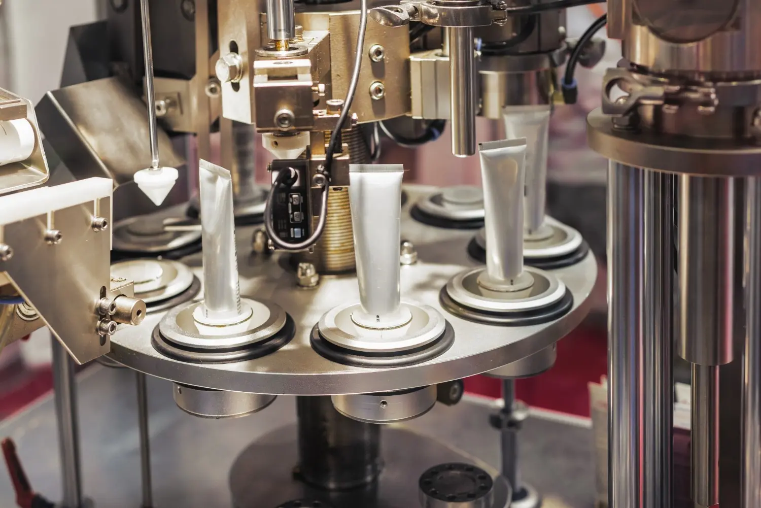 Automatic machine filling tubes in a manufacturing facility